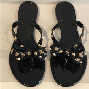 black studded flip flops